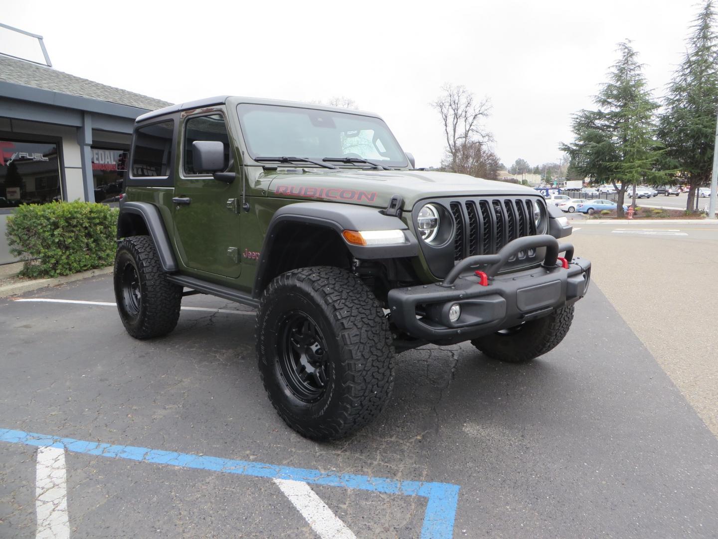 2021 Sarge Green /BLACK Jeep Wrangler Rubicon (1C4HJXCN4MW) with an 2.0L L4 DOHC 16V TURBO engine, 6A transmission, located at 2630 Grass Valley Highway, Auburn, CA, 95603, (530) 508-5100, 38.937893, -121.095482 - Rubicon featuring a Mopar suspension system, Fox shocks, 17" Fuel Wheels, BFG KO2 tires, Maxximus 3 front bumper stinger, Dual exhaust, Bolt hitch lock, Mopar HD tailgate hinge, and a custom cargo platform. - Photo#2